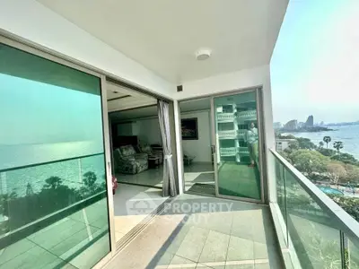 Stunning balcony with panoramic ocean view and spacious open living area