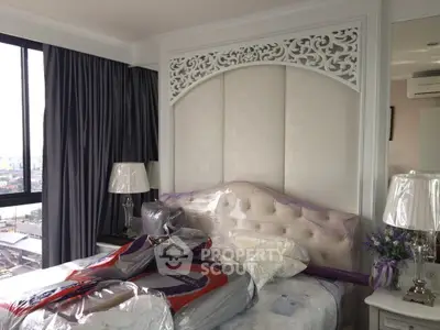 Luxurious bedroom with elegant decor and city view