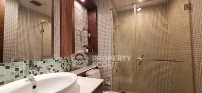 Modern bathroom with glass shower and stylish tile design