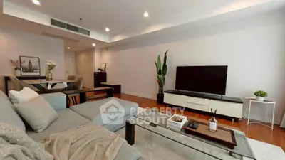 Spacious modern living room with stylish decor and entertainment setup