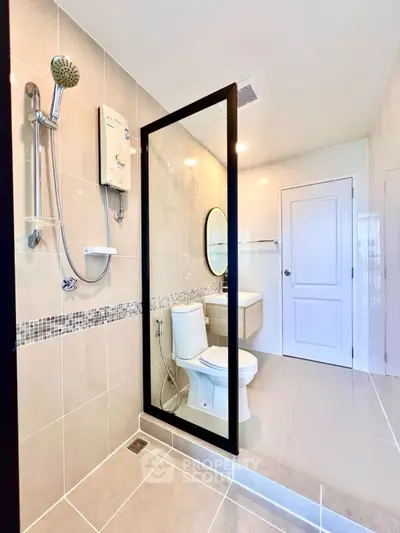 Modern bathroom with sleek design and large mirror in contemporary home.