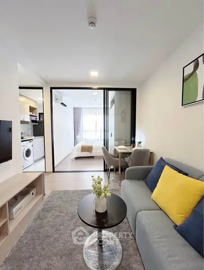 Modern open-plan living room with cozy sofa and stylish decor