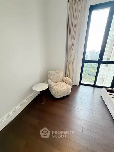 Cozy corner with armchair and window view in modern apartment
