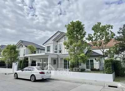 Charming suburban house with modern design and lush greenery