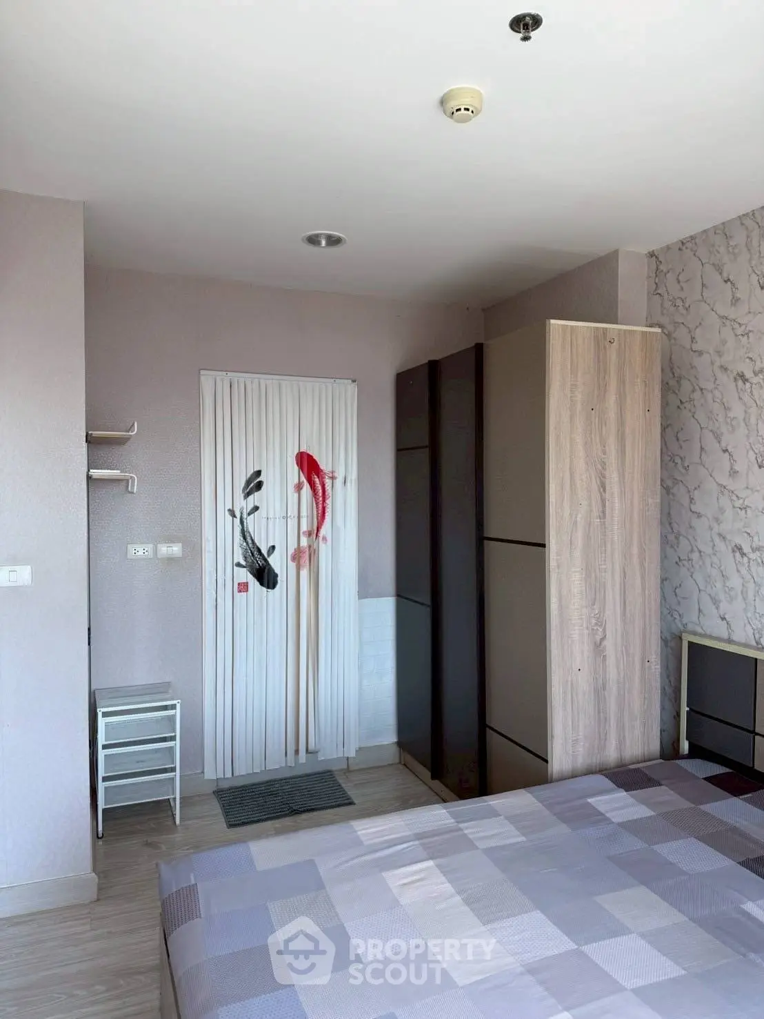 Modern bedroom with stylish decor and ample storage space