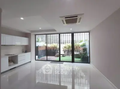 Spacious modern living room with garden view and sleek design