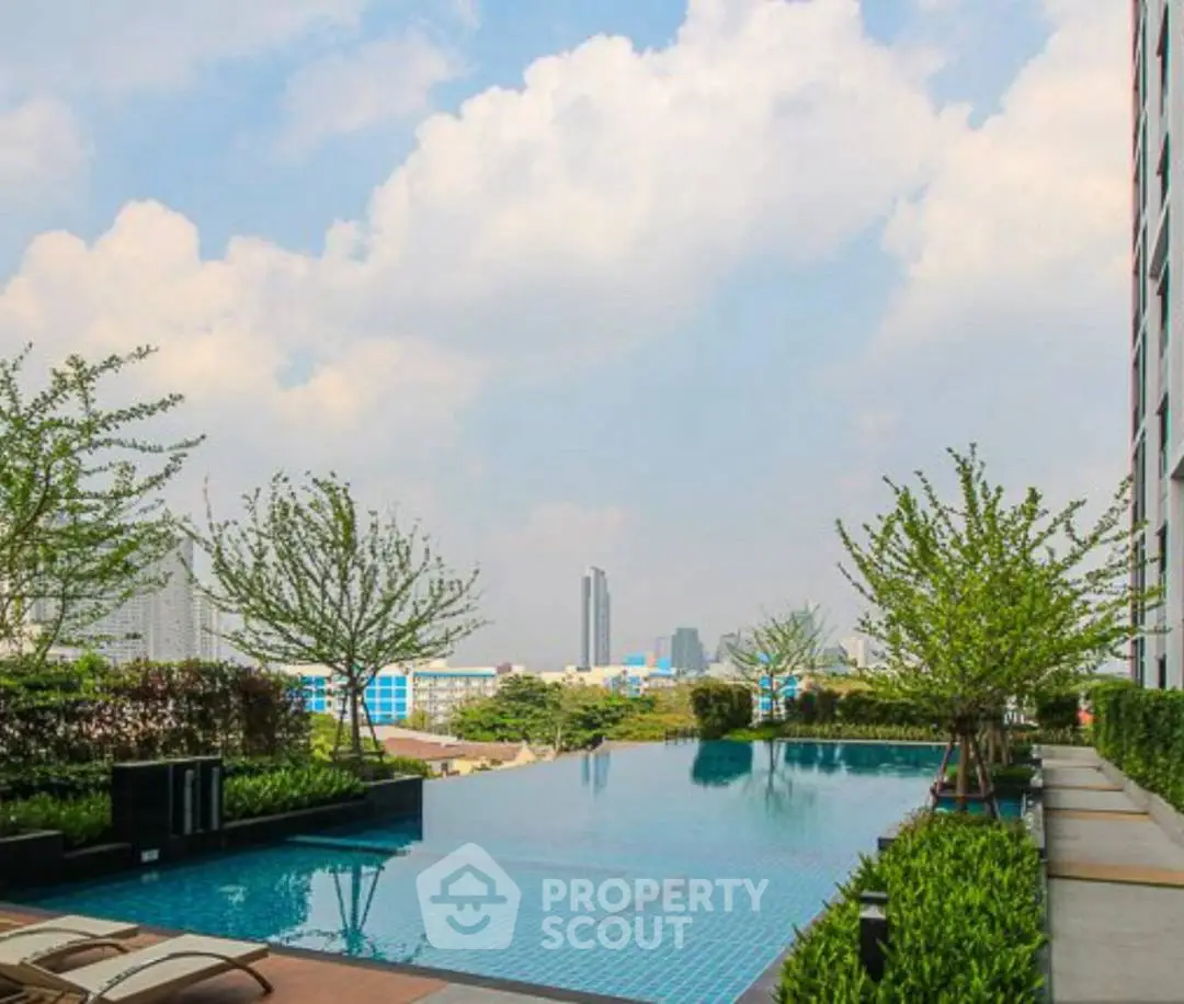 Luxurious rooftop pool with stunning city views and lush greenery.