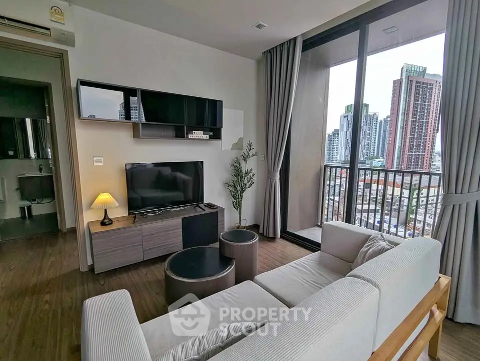 Modern living room with city view and stylish furniture in high-rise apartment
