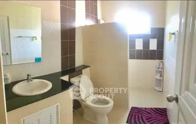 Spacious modern bathroom with sleek design and natural light
