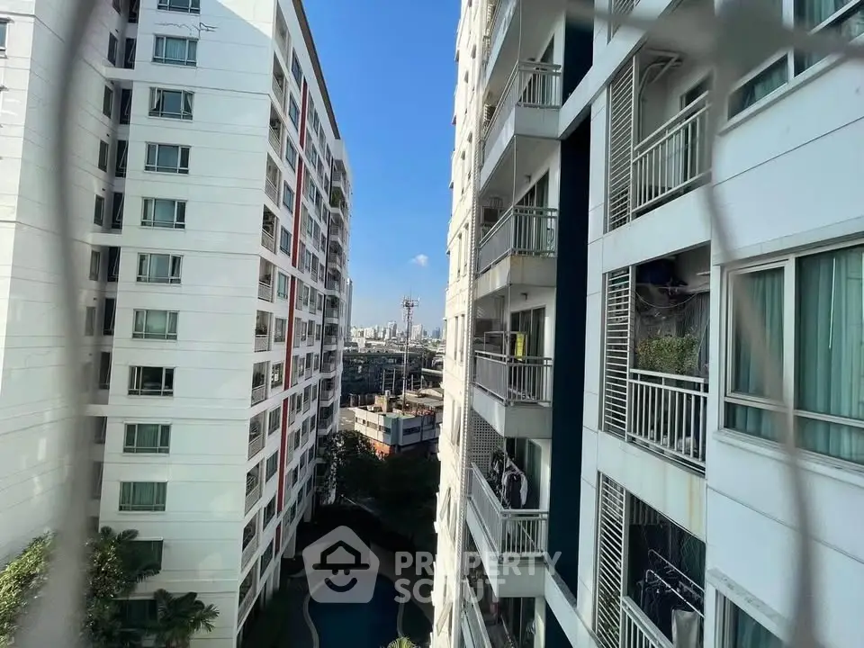 Stunning urban apartment view with pool and cityscape