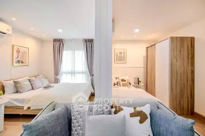 Spacious dual-bedroom setup with modern decor and ample natural light.