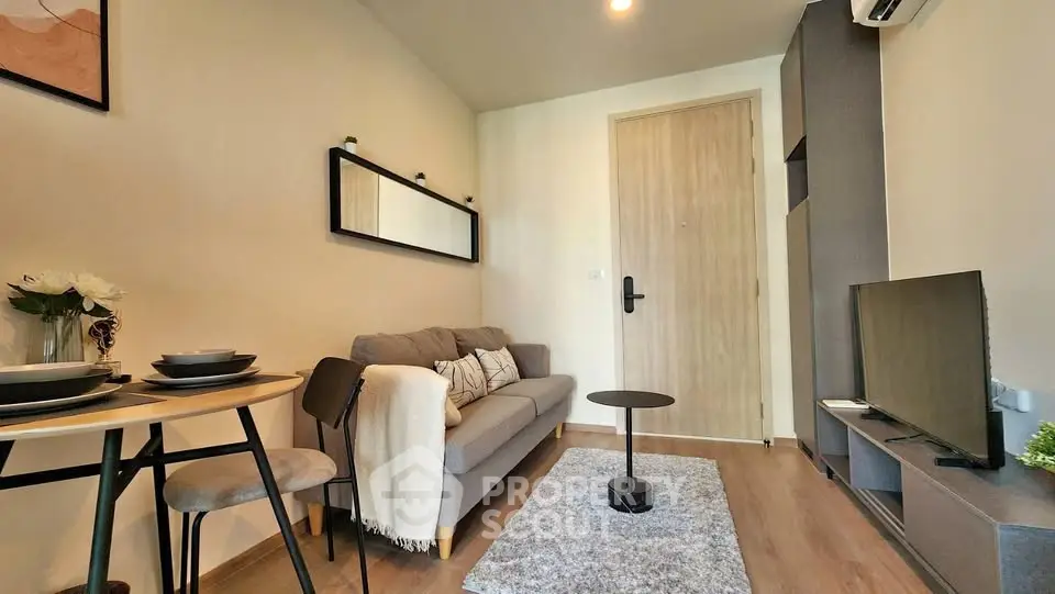 Cozy modern living room with stylish decor and compact furniture, perfect for urban living.