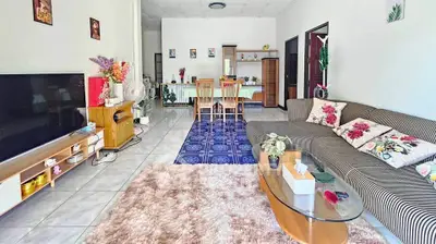 Spacious living room with modern decor and cozy seating area