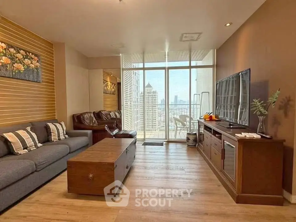 Spacious living room with modern decor and city view balcony