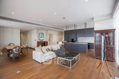 Spacious modern living room with open kitchen and elegant wooden flooring