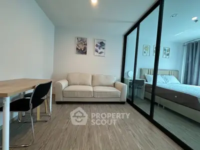 Modern living room with cozy sofa and stylish decor in a contemporary apartment.