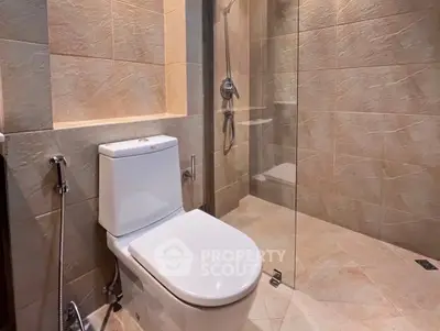 Modern bathroom with glass shower and sleek toilet design