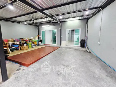 Spacious covered garage with storage area in modern home