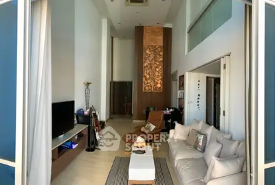 Spacious modern living room with high ceilings and elegant decor