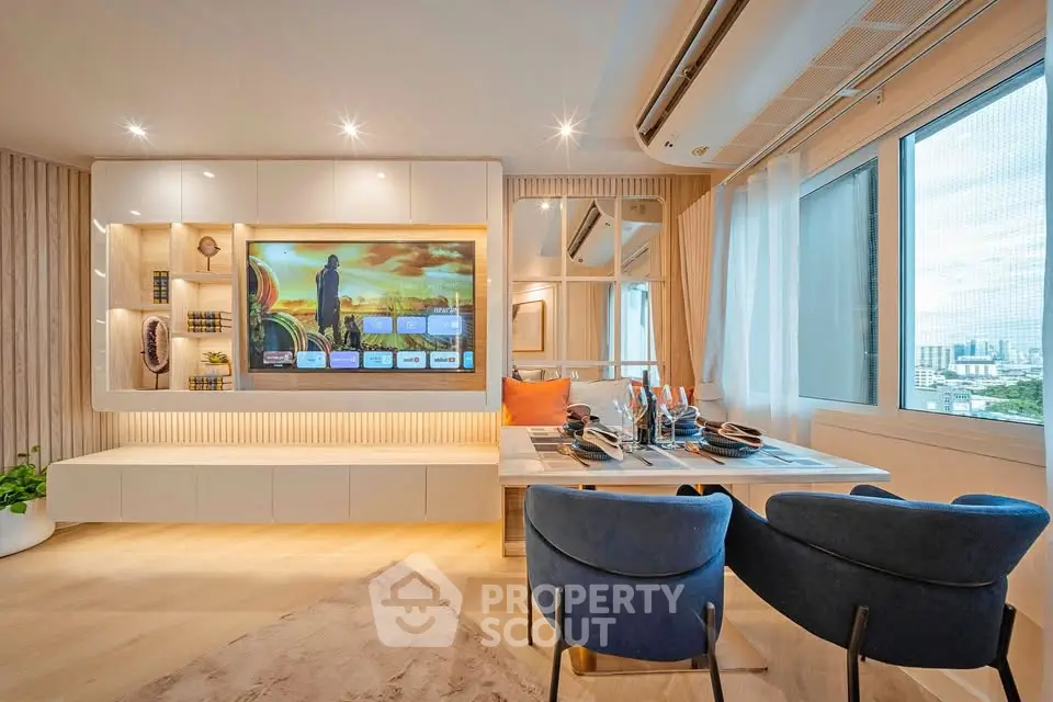 Modern living room with stylish decor and city view, featuring a built-in entertainment unit and dining area.