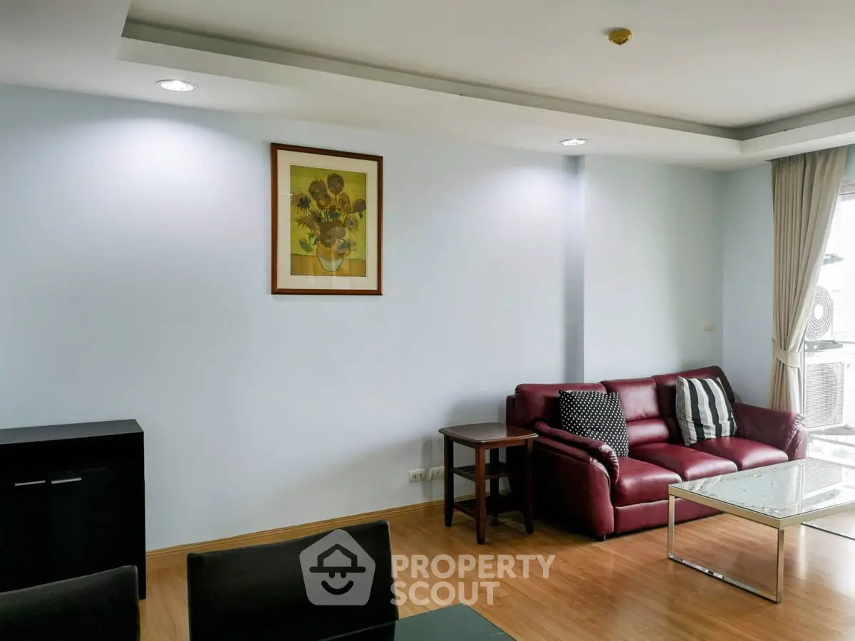 Modern living room with red leather sofa and stylish decor