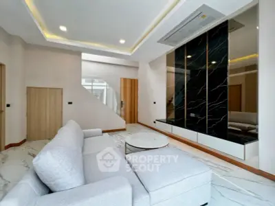 Modern living room with sleek design and luxurious marble flooring