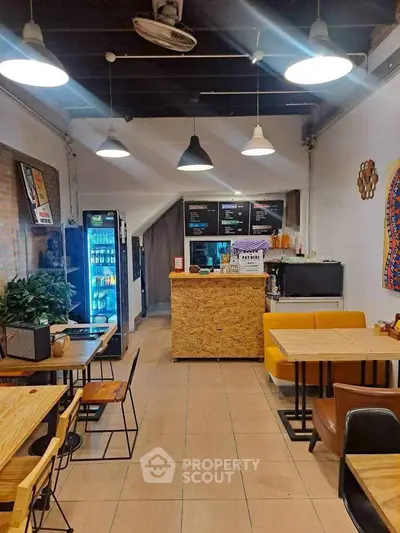 Charming cafe interior with modern decor and cozy seating area