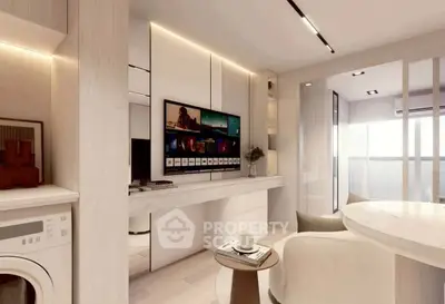 Modern living room with sleek design, featuring a wall-mounted TV, cozy seating, and a washing machine.