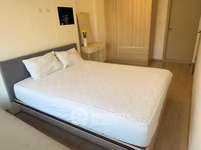 Cozy bedroom with modern furnishings and ample storage space