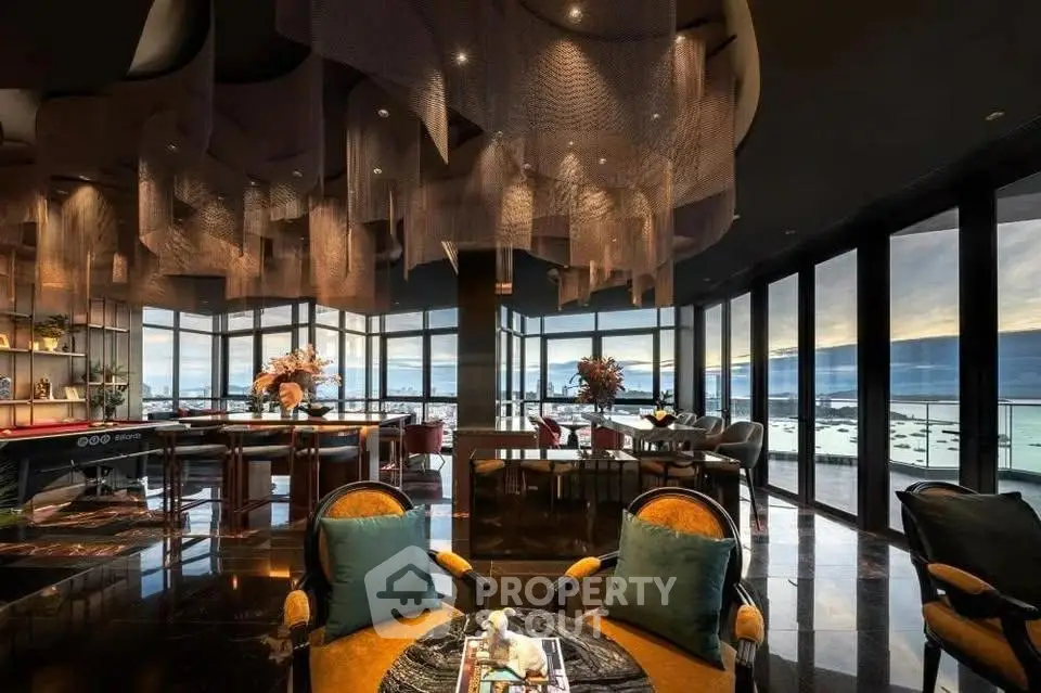 Luxurious penthouse living room with panoramic city views and elegant modern decor.
