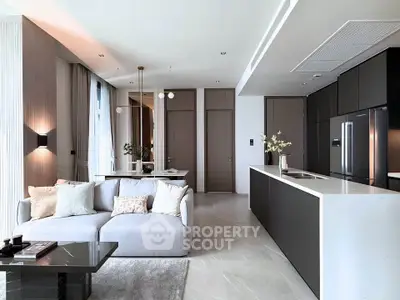 Luxurious modern living room with open kitchen, sleek design, and elegant decor in a high-end apartment.
