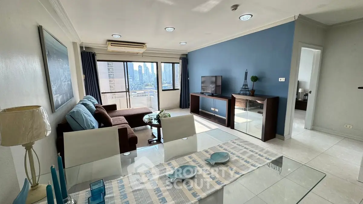 Spacious living room with city view, modern furniture, and elegant decor in a high-rise apartment.