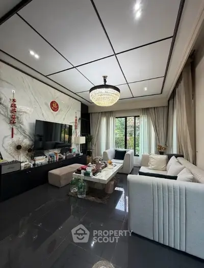 Luxurious living room with elegant chandelier and modern decor