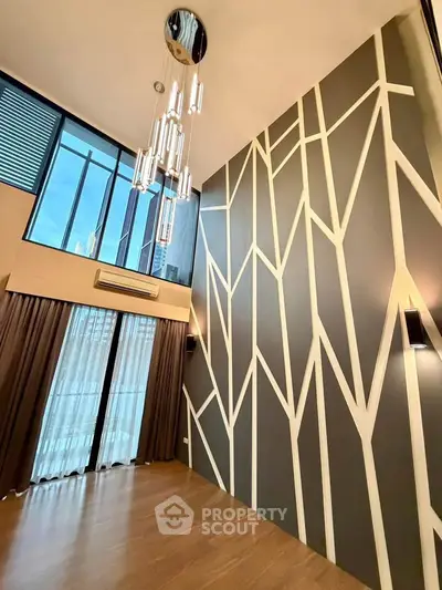 Stunning modern living room with high ceilings and unique wall design