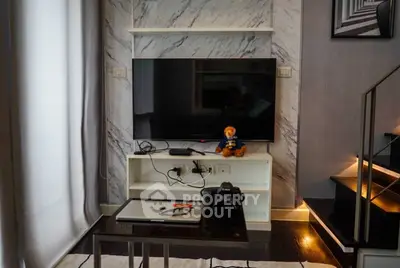 Modern living room with marble accent wall and sleek TV setup