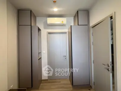 Modern hallway with sleek storage cabinets and air conditioning unit