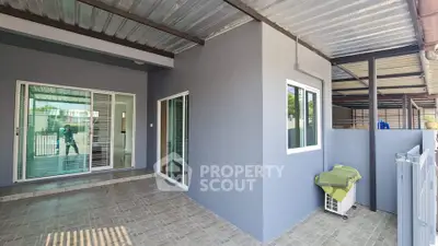 Modern covered patio with sliding glass doors and tiled flooring