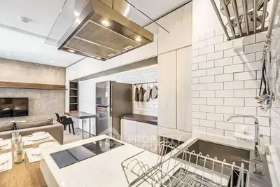 Modern kitchen with sleek appliances and open layout in stylish apartment