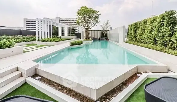 Luxurious rooftop pool with modern design and lush greenery, perfect for relaxation and leisure.