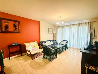 Charming living room with cozy seating and vibrant decor, perfect for relaxation and entertainment.