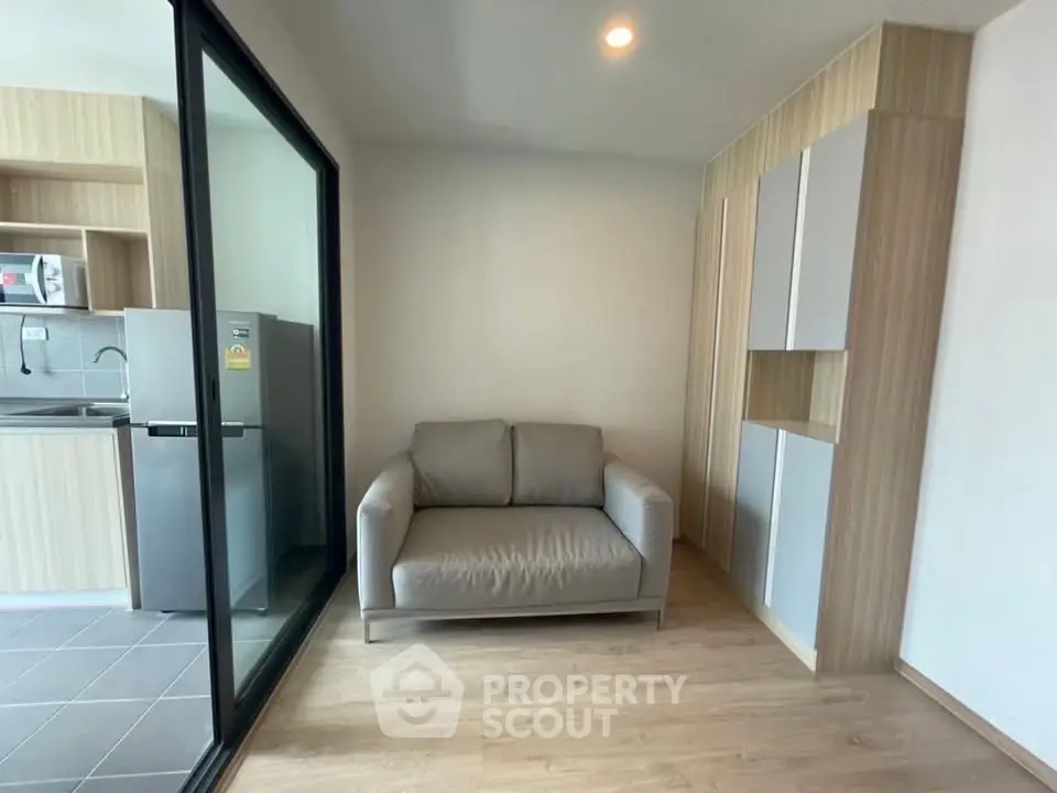 Modern apartment interior with cozy living area and sleek kitchen design