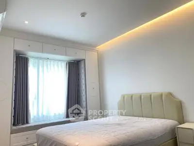 Bright and modern bedroom with elegant lighting and window seating