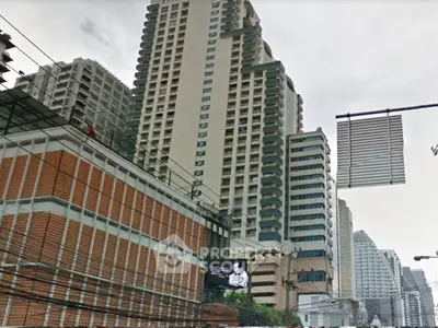 High-rise residential buildings in urban setting with modern architecture.