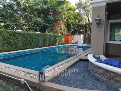 Charming backyard with private swimming pool and lush greenery, perfect for relaxation and entertainment.