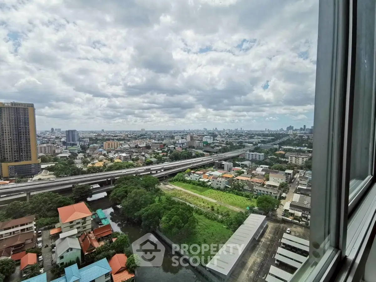 Stunning cityscape view from high-rise building window showcasing urban landscape and skyline.