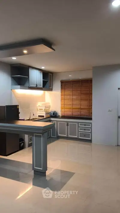 Modern kitchen with sleek cabinetry and open layout design