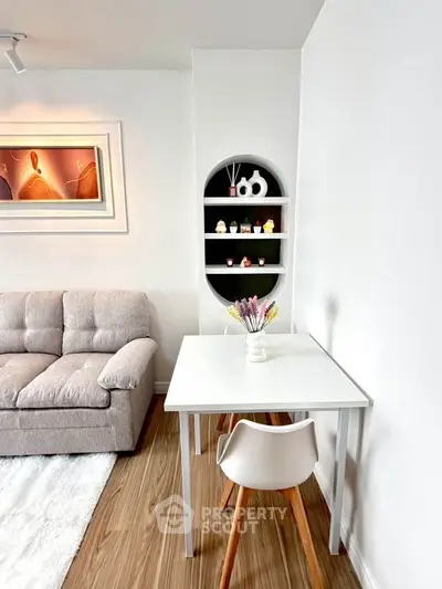 Modern living room with stylish decor and cozy seating area, perfect for relaxation and entertaining.