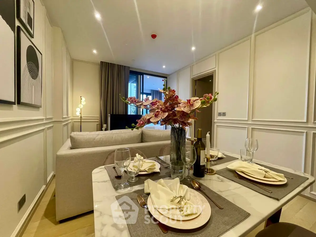 Elegant living room with dining area, modern decor, and cozy ambiance