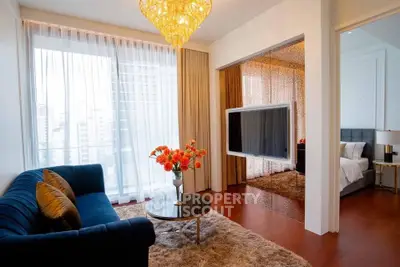 Luxurious living room with elegant decor and city view, featuring plush sofa and modern design elements.