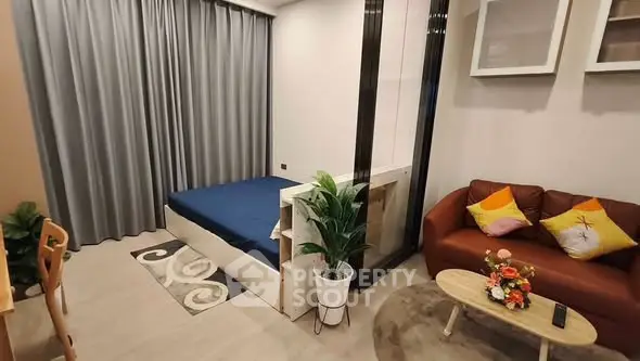 Modern studio apartment with cozy living area and stylish decor